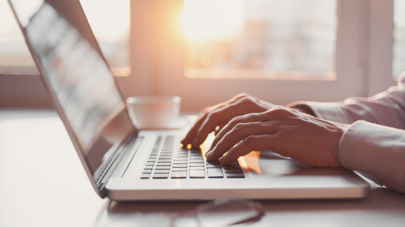 Image of person typing on a computer